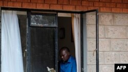 A man reads a book to pass the time at a government designated quarantine facility in Nairobi on April 4, 2020.