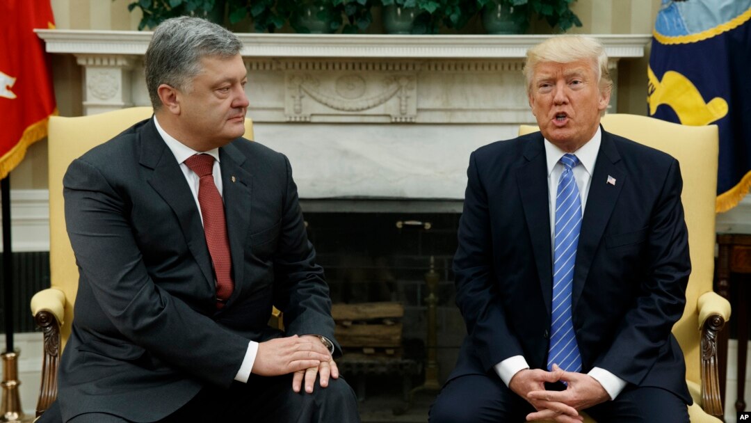 President Donald Trump, right, speaks during a meeting with Ukrainian President Petro Poroshenko in the Oval Office of the White House, in Washington, June 20, 2017.