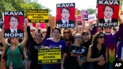 Demonstrators protest against Supreme Court nominee Brett Kavanaugh as they march to the U.S. Supreme Court, Oct. 4, 2018, in Washington. 