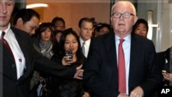U.S. Special Envoy for North Korea Policy Stephen Bosworth (R) and U.S ambassador to the International Atomic Energy Agency Glyn Davies (L) leave their hotel for the United States Mission in Geneva, October 24, 2011.