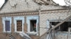 A municipal worker inspects a house damaged by a Russian drone strike, amid Russia's attack on Ukraine, in Zaporizhzhia, Ukraine, November 25, 2024. 