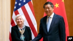 FILE - Treasury Secretary Janet Yellen, left, shakes hands with Chinese Vice Premier He Lifeng during a meeting at the Diaoyutai State Guesthouse in Beijing, China, July 8, 2023. Yellen is hosting He for two days of talks this week. 