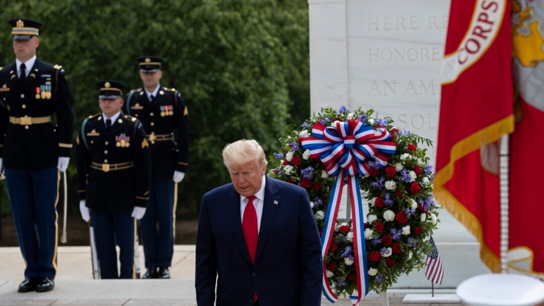 Memorial day. A female soldier in uniform salutes against the