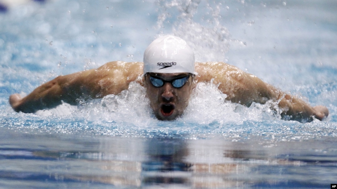 Michael Phelps competes in the 100-meter butterfly at the Indianapolis Grand Prix swimming meet in Indianapolis on March 29, 2012. 