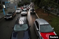 Los manifestantes el sábado 23 de enero de 2021 piden la destitución del presidente Jair Bolsora, en Sao Paulo, Brasil. [Reuters]