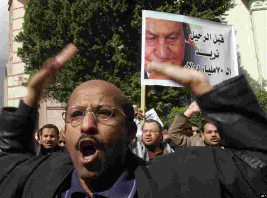 An Egyptian lawyer shouts anti-Mubarak slogans as lawyers streamed into Cairo's Tahrir Square, Thursday, Feb. 10, 2011. Labor unrest across the country gave powerful momentum to Egypt's wave of anti-government protests. With its efforts to manage the cris