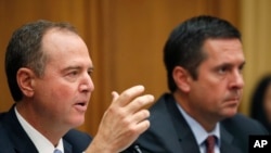 FILE - Chairman Adam Schiff, D-Calif., left, and ranking member Rep. Devin Nunes, R-Calif., are pictured during a House Intelligence Committee hearing on Capitol Hill, July 24, 2019, in Washington.