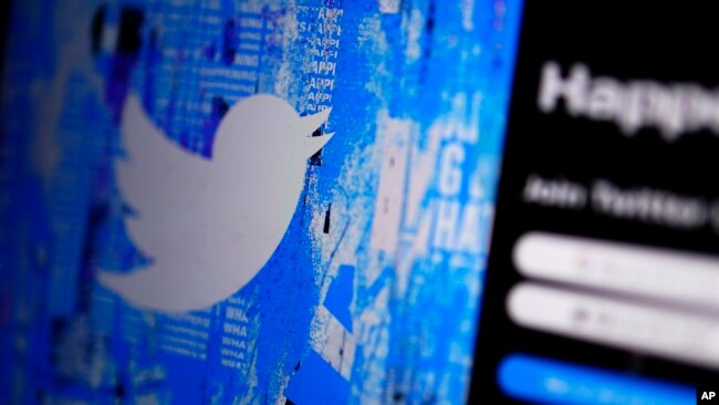 FILE - The Twitter splash page is seen on a digital device on April 25, 2022, in San Diego.