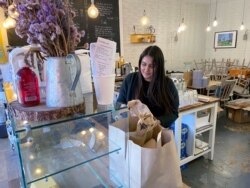London Cafe owner Amira Gajia shuts down her cafe in Hackney to volunteer her services to the NHS, as the spread of the coronavirus disease (COVID-19) continues, in London, Britain, March 25, 2020.
