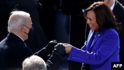 (FILES) US Vice President Kamala Harris bumps fists ahead of the inauguration of Joe Biden as the 46th US President on January 20, 2021, at the US Capitol in Washington, DC.