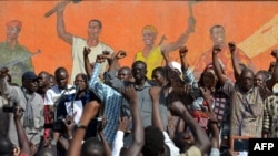 Opposition leaders gather during a protest at the Place de la Nation in Burkina Faso's capital Ouagadougou, calls for the departure of the military, Nov. 2, 2014.