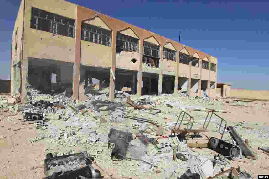 A damaged school building which was used by Kurdish fighters as a base, in al-Aziza, Oct. 7, 2014. 