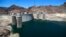 FILE - The low level of the water line is shown on the banks of the Colorado River at the Hoover Dam in Hoover Dam, Arizona, May 31, 2018.