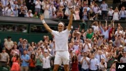 Switzerland's Roger Federer celebrates after defeating Croatia's Marin Cilic to win the Men's Singles final match on day thirteen at the Wimbledon Tennis Championships in London, July 16, 2017. 