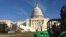 A tractor drives on the U.S. Capitol lawn near the site where President Barack Obama's swearing-in ceremony will be held in January 2013. (Photo: VOA/Sandra Lemaire)