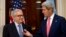 10月14日阿拉伯联盟特使卜拉希米(左)与美国国务卿克里在美国驻英大使官邸交谈