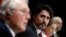 Canada's Prime Minister Justin Trudeau listens to Minister of Public Safety and Emergency Preparedness Bill Blair during a news conference on Parliament Hill in Ottawa, Ontario, May 1, 2020.