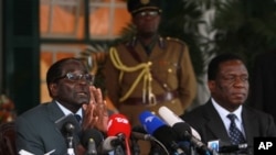 FILE: Zimbabwean President Robert Mugabe, left, and Vice Presidentr Emmerson Mnangagwa, at State House press conference, Harare.
