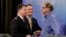 Senate candidates from left, Todd Rokita, Luke Messer and Mike Braun speak with each other following the Indiana Republican senate primary debate in Indianapolis, April 30, 2018.