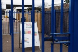 General view of a sign outside the Parkside Community Primary School in Borehamwood as the spread of the coronavirus disease (COVID-19) continues, in Borehamwood, Britain, March 18, 2020.