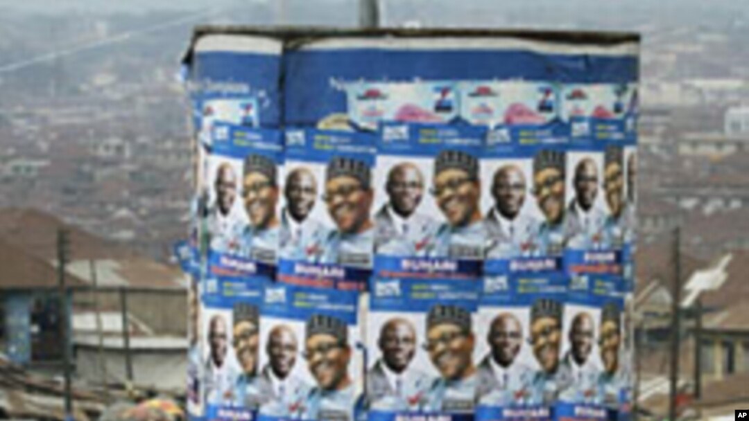 An advertisement tank is plastered with posters of former military ruler Muhammadu Buhari and his running mate Tunde Bakare during the Congress for Progressive Change (CPC) presidential campaign rally at Mapo square, Ibadan, south-west Nigeria, Mar 14 20