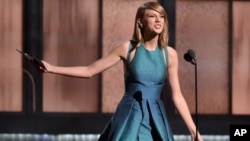 Taylor Swift presents the award for best new artist at the 57th annual Grammy Awards on Feb. 8, 2015, in Los Angeles.