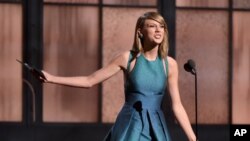 Taylor Swift presents the award for best new artist at the 57th annual Grammy Awards on Feb. 8, 2015, in Los Angeles.