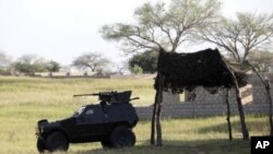 An armored vehicle is parked in front of the joint task force headquarters in Maiduguri, Nigeria. (File Photo - September 26, 2011)