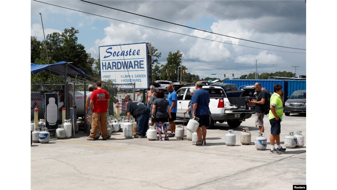 Customers line up to buy propane at Socastee Hardware store, ahead of the arrival of Hurricane Florence in Myrtle Beach, South Carolina, Sept. 10, 2018.