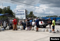 Customers line up to buy propane at Socastee Hardware store, ahead of the arrival of Hurricane Florence in Myrtle Beach, South Carolina, Sept. 10, 2018.