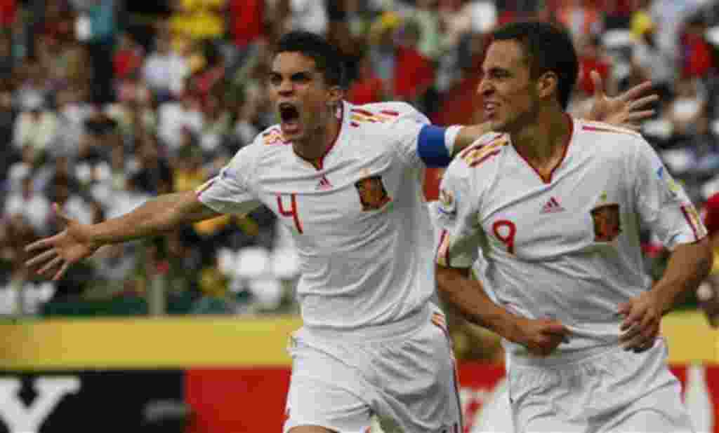 Spain's Marc Bartra, left, celebrates after teammate Rodrigo, right, scored against Costa Rica during a U-20 World Cup group C soccer match in Manizales, Colombia, Sunday, July 31, 2011. (AP Photo/Nestor Silva)
