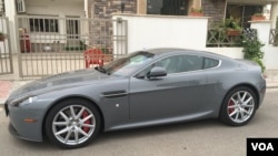 In a sign that some people in cash-strapped Iraqi Kurdistan still have means for the extravagant, a meticulously polished late-model Aston Martin is seen parked on a street in Irbil, the region's capital. (S. Behn/VOA)