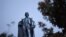 A 100-foot monument to former U.S. vice president and slavery advocate John C. Calhoun towers over a downtown square Tuesday, June 23, 2020, in Charleston, S.C.