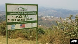 FILE - Picture showing the entrance placard of the Kiziba camp in western Rwanda, Sept. 6, 2016.