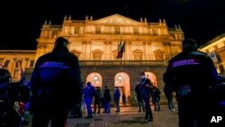Italian Carabinieri police patrol outside La Scala opera house for the premiere of Verdi's Macbeth in Milan, Italy, Dec. 7, 2021. 
