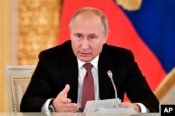 Russian President Vladimir Putin speaks during a meeting in Moscow's Kremlin, Russia, Tuesday, Nov. 27, 2018.