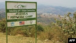 FILE - Picture showing the entrance placard of the Kiziba camp in western Rwanda, Sept. 6, 2016.