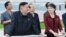 North Korean leader Kim Jong Un (2nd L) and a woman being identified by state TV as his wife 'Comrade Ri Sol Chu,' visit the Rungna People's Pleasure Ground, which is nearing completion, in Pyongyang, July 25, 2012.