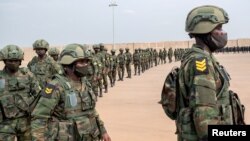 FILE - Rwandan military troops depart for Mozambique to help the country combat an escalating Islamic State-linked insurgency that threatens its stability, at the Kigali International Airport in Kigali, Rwanda July 10, 2021.