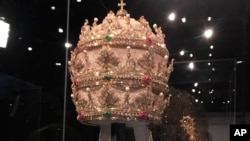 A jewel-encrusted papal tiara from the Sistine Chapel sacristy at the Vatican is displayed at the Metropolitan Museum of Art, May 7, 2018.