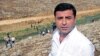 Co-chairman of the pro-Kurdish Peoples' Democratic Party, Selahattin Demirtas walks with his party members to the southeastern town of Cizre, near Idil in Sirnak province, Turkey, Sept. 10, 2015.