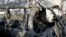 Photo released by Syria's official news agency shows damaged vehicle at scene of an attack, Damascus, Nov. 7, 2012.