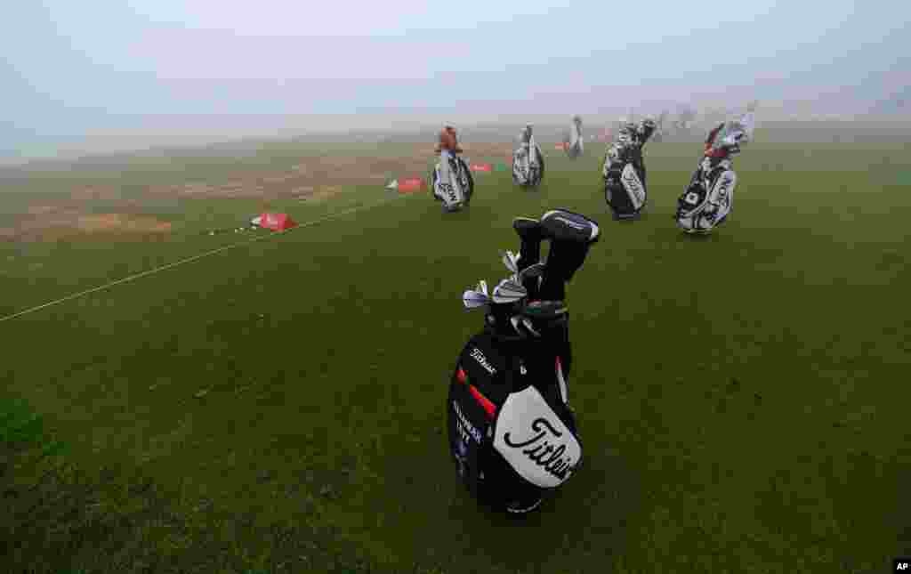 Players' bags sit abandoned on the practice range as fog delayed the start of the second round of the Abu Dhabi HSBC Golf Championship in Abu Dhabi, United Arab Emirates.