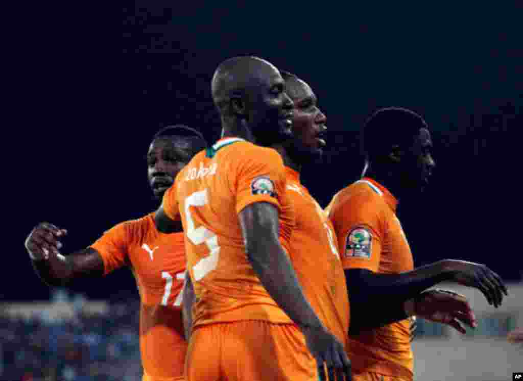 Ivory Coast's Tiene, Zokora, Drogba and Toure celebrate after scoring against Burkina Faso during their African Nations in Malabo
