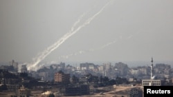 Trails of smoke are seen after the launch of rockets from the northern Gaza strip towards Israel (file photo).