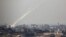 Trails of smoke are seen after the launch of rockets from the northern Gaza strip towards Israel (file photo).