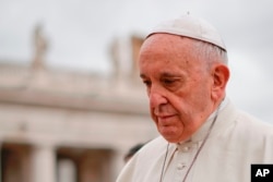 FILE - Pope Francis arrives in St. Peter's Square at the Vatican, April 11, 2018.