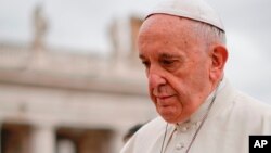 FILE - Pope Francis arrives in St. Peter's Square at the Vatican, April 11, 2018.