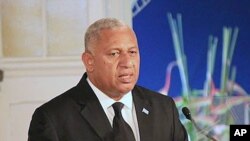 FILE - Fiji's leader Frank Bainimarama comments on how the country's constitution enshrines principles including an independent judiciary, a secular state, and a range of civil, political, and socio-economic rights, during a speech in Suva, Sept. 6, 2013.