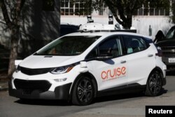 FILE - A self-driving GM Bolt EV is seen during a media event where Cruise, GM's autonomous car unit, showed off its self-driving cars in San Francisco, California, Nov. 28, 2017.